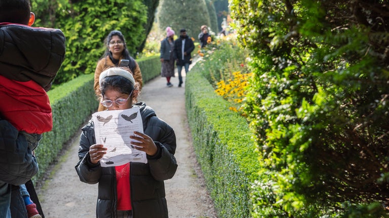 Child taking part in Trail in a Bag at Powis Castle and Garden